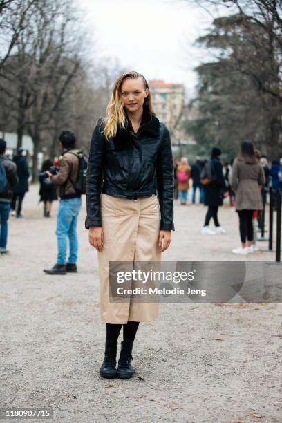 Supermodel Gemma Ward wears a black leather jacket, tan dress, and black shoes after the Roberto Cavalli show on Day 4 Milan Fashion Week...