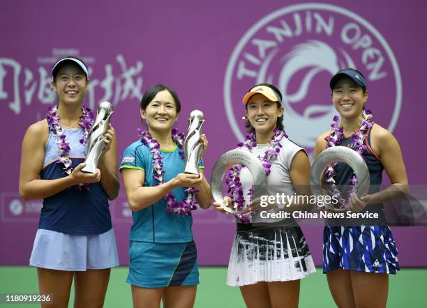 First place Ena Shibahara and Shuko Aoyama of Japan, runner up Nao Hibino and Miyu Kato of Japan pose with their trophies after Women's doubles final...