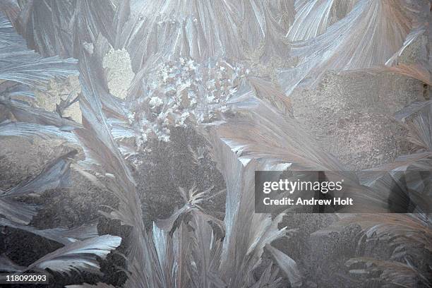 jack frost ice crystals on a window - ice stock-fotos und bilder