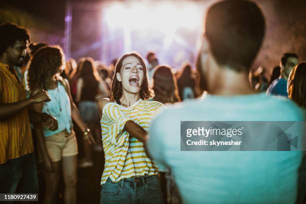young couple dancing and singing on music concert by night. - white nights festival imagens e fotografias de stock