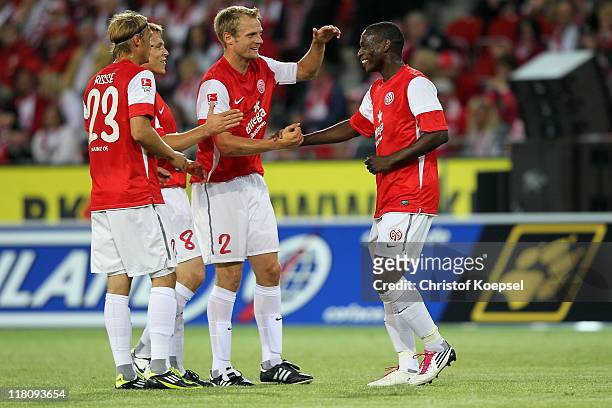 Marcel Risse, Radoslav Zabavnik, Bo Svensson and Anthony Ujah of Mainz celebrate a goal during the friendly match between FSV Mainz 05 and a...