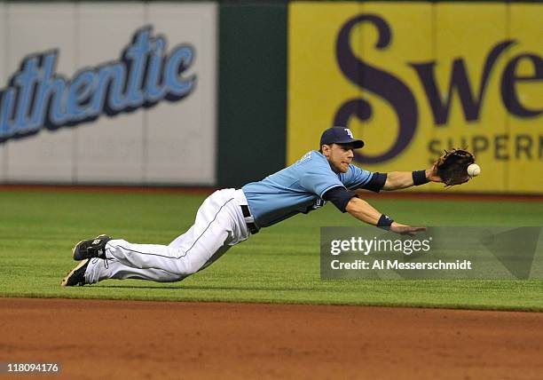 Infielder Ben Zobrist of the Tampa Bay Rays dives for a ground ball against the St. Louis Cardinals July 3, 2011 at Tropicana Field in St....