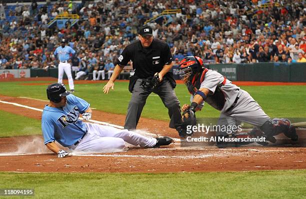 Designated hitter Johnny Damon of the Tampa Bay Rays slides home with a run against the St. Louis Cardinals July 3, 2011 at Tropicana Field in St....