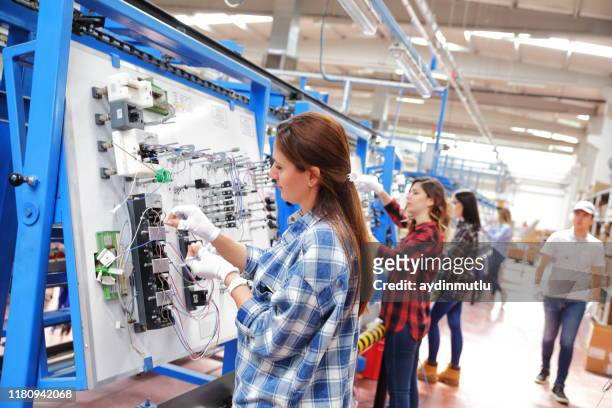 factory workers - production line worker stock pictures, royalty-free photos & images