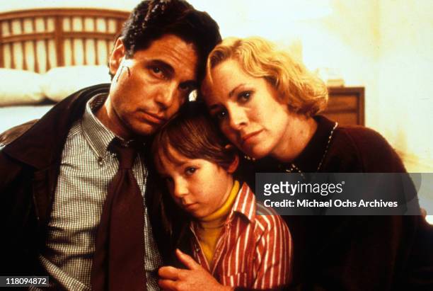 Actors Chris Sarandon and Catherine Hicks with child actor Alex Vincent in a scene from the film 'Child's Play', 1988.
