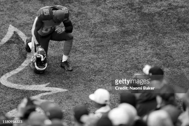 Bobo Wilson of Tampa Bay Buccaneers takes a moment to pray in the end zone ahead of the NFL game between Carolina Panthers and Tampa Bay Buccaneers...