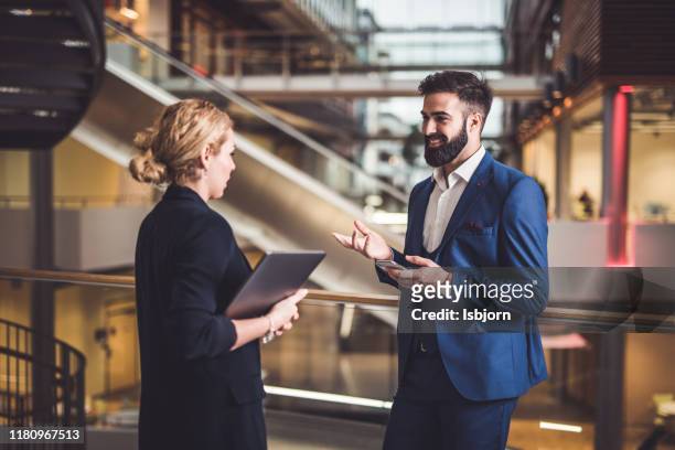 business people talking about solution. - businesswear stock pictures, royalty-free photos & images