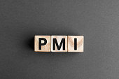 PMI - acronym from wooden blocks with letters