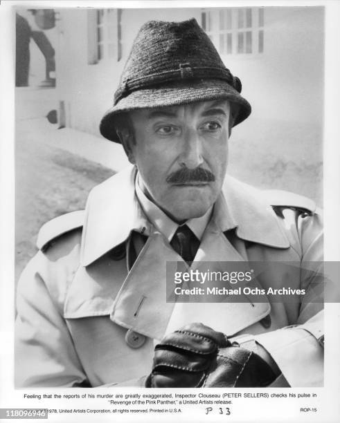 Peter Sellers as Inspector Clouseau checks his pulse in a scene from the film 'The Pink Panther Strikes Again', 1976.