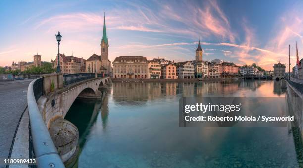 dawn over fraumunster church and limmat river, zurich - zurich landmark stock pictures, royalty-free photos & images