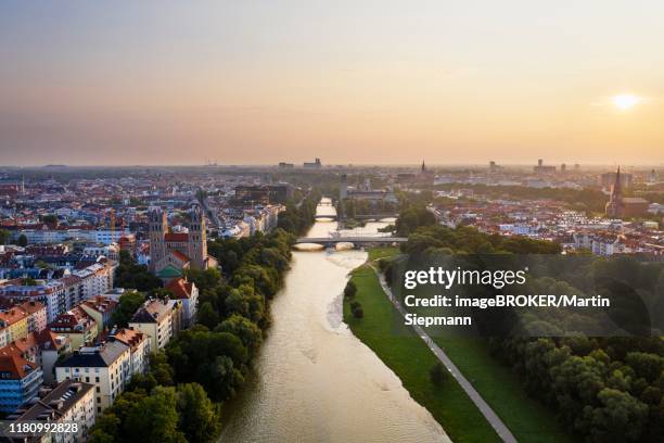 view to city, isar and green areas with reichenbach bridge at sunrise, left maximilianskirche and center deutsches museum, aerial view, munich, upper bavaria, bavaria, germany - munich drone stock pictures, royalty-free photos & images