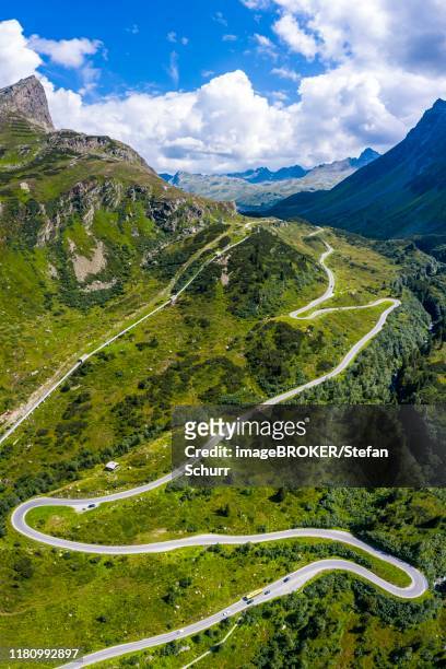 drone shot, winding road, silvretta high alpine road, montafon, vorarlberg, austria - montafon valley stock pictures, royalty-free photos & images