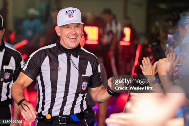 Referee Clete Blakeman greets fans in the tunnel before a game between the Indianapolis Colts and the Tennessee Titans at Nissan Stadium on September...