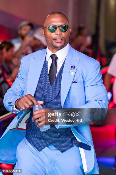 Former player Eddie George of the Tennessee Titans greets fans in the tunnel before a game against the Indianapolis Colts at Nissan Stadium on...