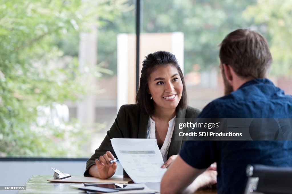 Cheerful businesswoman meets with client