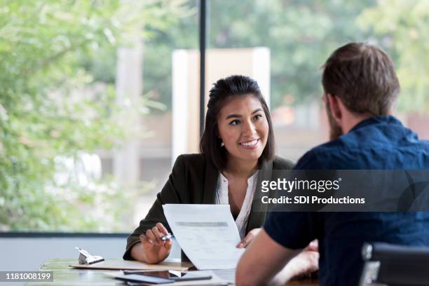 cheerful businesswoman meets with client - insurance stock pictures, royalty-free photos & images