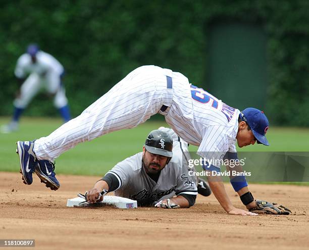 Carlos Quentin of the Chicago White Sox is forced out at second baseby Darwin Barney of the Chicago Cubs on July 3, 2011 at Wrigley Field in Chicago,...