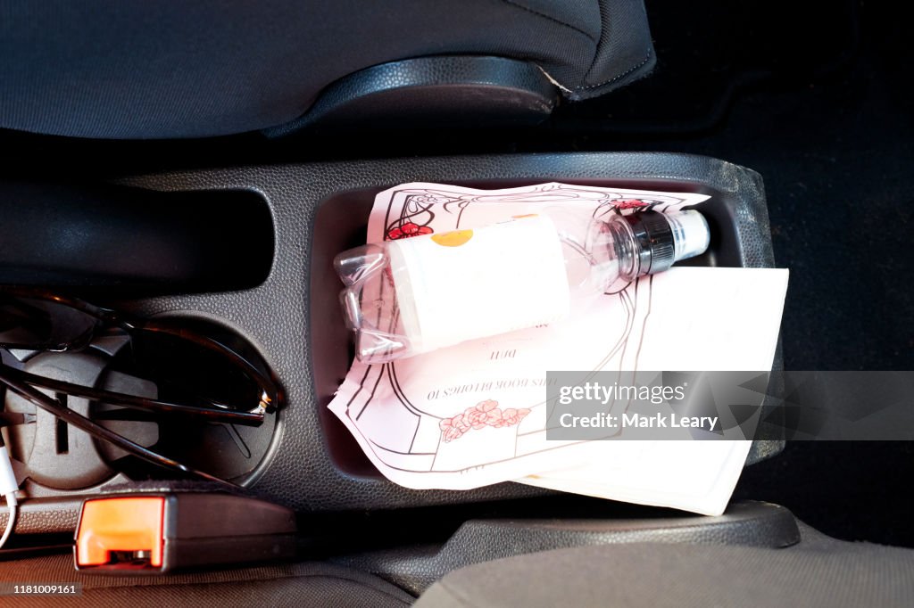 Car interior with random cables and messy interior