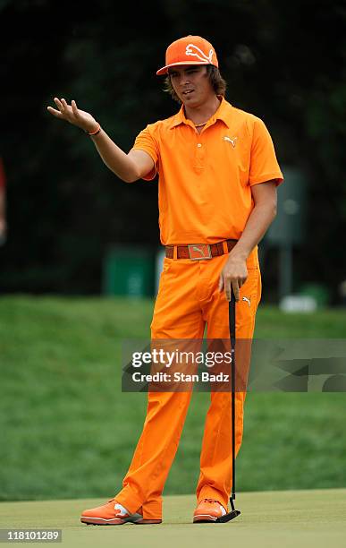 Rickie Fowler waves back at his putt on the third hole during the final round of the AT&T National at Aronimink Golf Club on July 3, 2011 in Newtown...