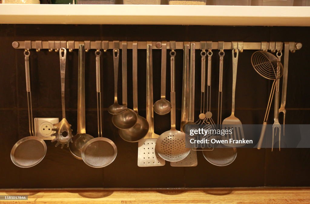 Cooking Instruments Hanging In A Professional Kitchen High-Res Stock ...