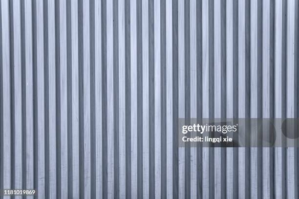 a silver-gray striped wall. - シートメタル ストックフォトと画像