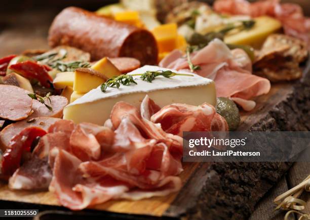 charcuterie board - wurstwaren stock-fotos und bilder