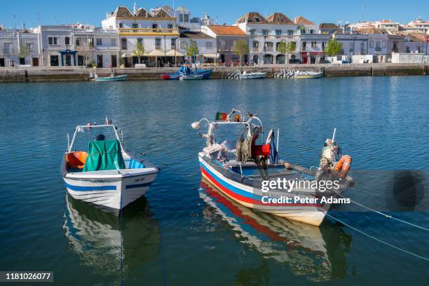 tavira, portugal - april 2019: fishing boats in the harbour of tavira, algave, portugal - tavira fotografías e imágenes de stock