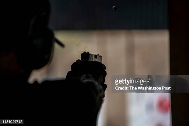 September 10: A pistol user, Roderick White using a Glock 17 9mm pistol, takes aim and shoots at targets at HW Range and Training within the pistol...