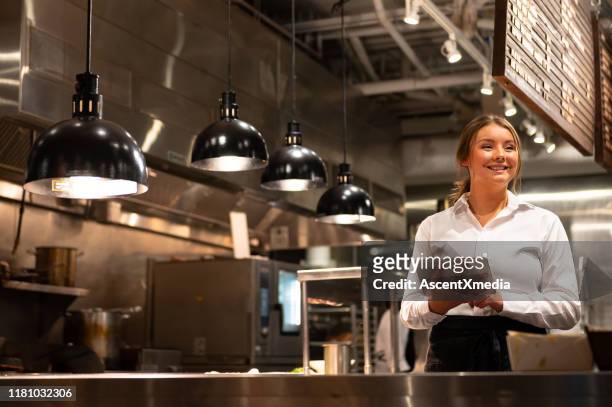 server adding a new order with a tablet - food and drink industry stock pictures, royalty-free photos & images