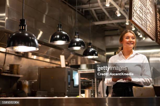 server adding a new order with a tablet - restaurant manager stock pictures, royalty-free photos & images