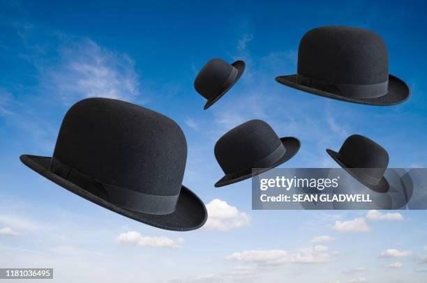 bowler hats in sky - melone hut stock-fotos und bilder