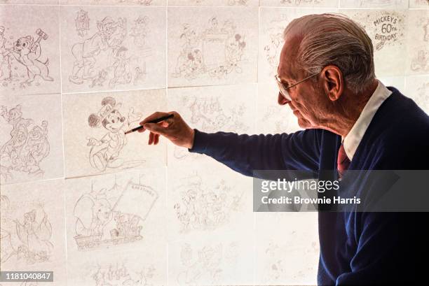 American animator Harry Holt works on a pencil drawing of Mickey Mouse, Orlando, Florida, 1988.