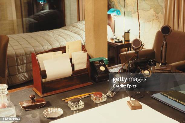 General view of the desk and bedroom of British Prime Minister Winston Churchill at the cabinet war rooms, London, circa 1990. The microphones were...