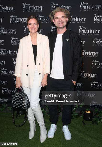 Simen Staalnacke and Anne Berit Valla attend "Maleficent 2" Disney Premiere at Colosseum on October 14, 2019 in Oslo, Norway.