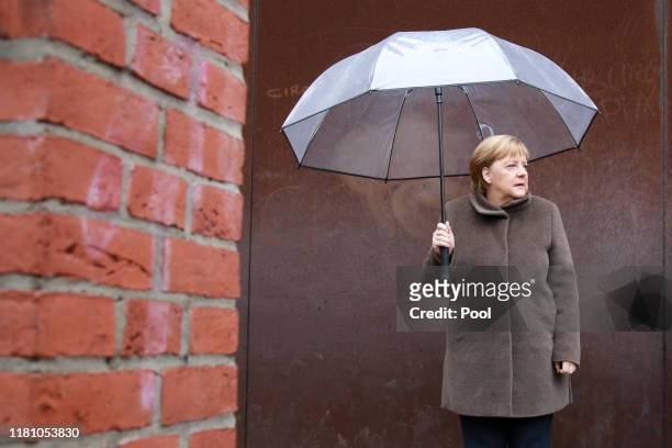 Chancellor Angela Merkel attends the commemoration of the Berlin Wall Foundation on Bernauer Strasse during the 30th anniversary celebrations of the...