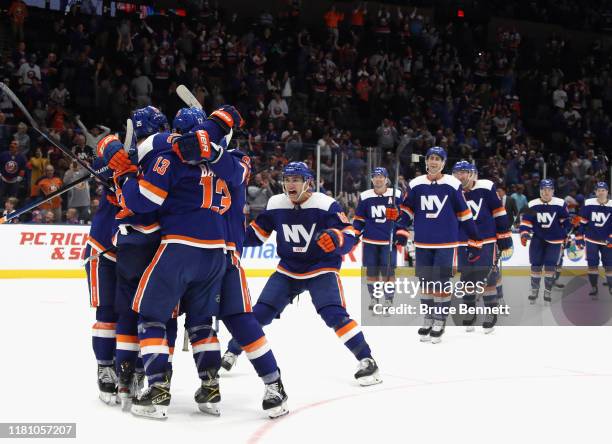 The New York Islanders celebrate the game winning goal by Devon Toews against the St. Louis Blues at 1:13 of overtime at NYCB Live's Nassau Coliseum...