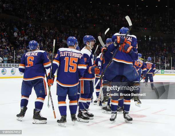 The New York Islanders celebrate the game winning goal by Devon Toews against the St. Louis Blues at 1:13 of overtime as Tom Kuhnhackl picks up...