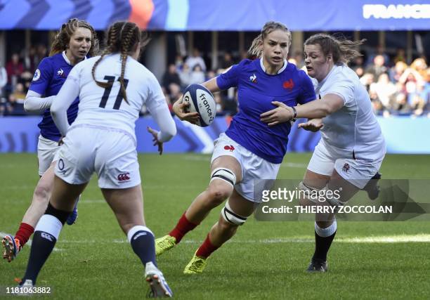 France's wing Romane Menager runs with the ball during the international women's Rugby union test match between France and England at the Marcel...