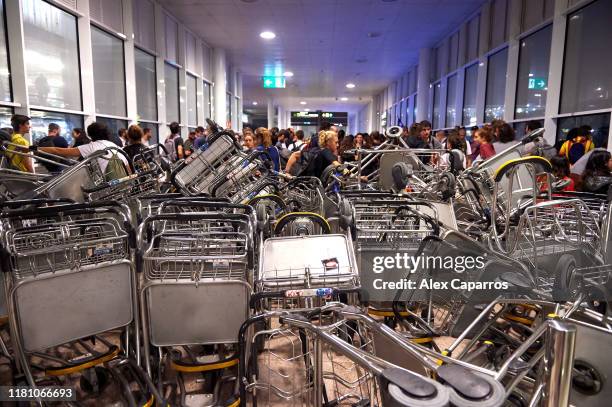 Barricades are seen at Barcelona Airport as people take part in a protest following the sentencing of nine Catalan separatist leaders on October 14,...