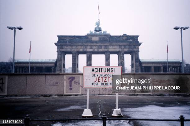 Picture taken in 1988 and made available on November 9, 2019 shows a view taken from West Berlin towards East Berlin, the Wall and the Brandenburg...