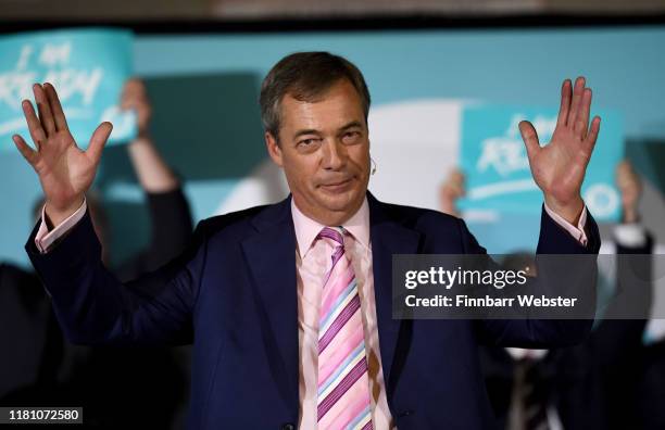 Leader of the Brexit Party, Nigel Farage addresses the audience at The Brexit Party rally at Carn Brea Leisure Centre, on October 14, 2019 in...