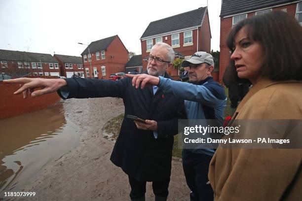 Labour leader Jeremy Corbyn and Labour MP Caroline Flint during a visit to Conisborough, South Yorkshire, where he met residents affected by flooding.