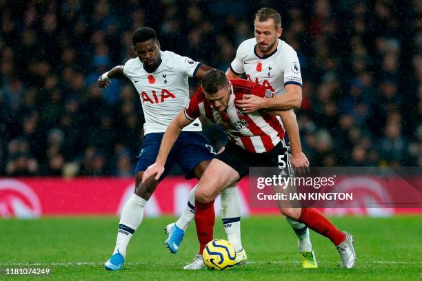 Sheffield United's English defender Jack O'Connell vies with Tottenham Hotspur's English striker Harry Kane during the English Premier League...