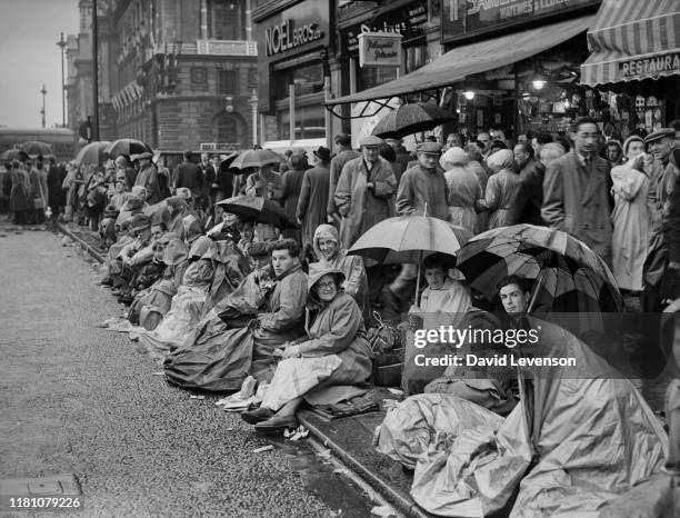 The Coronation of Queen Elizabeth II. Crowds of well wishers line the route of the Coronation procession in London on June 2, 1953. Many camped out...