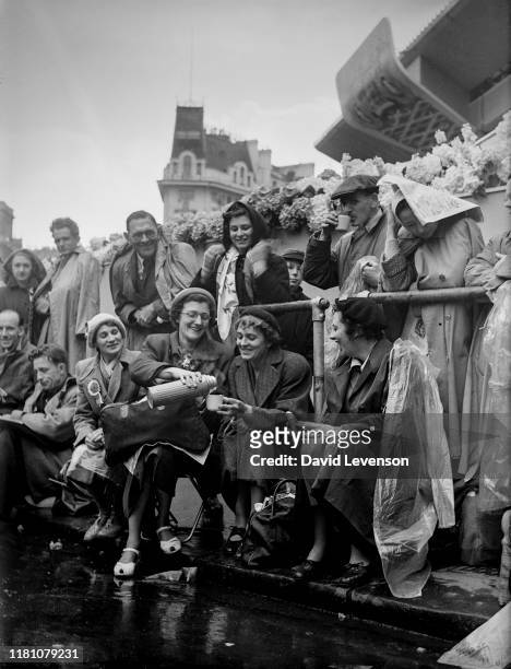 The Coronation of Queen Elizabeth II. Crowds of well wishers line the route of the Coronation procession in London on June 2, 1953. Many camped out...