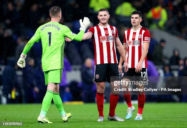 Sheffield United goalkeeper Dean Henderson shakes hands with team mate Jack O'Connell at the end of the Premier League match at Tottenham Hotspur...