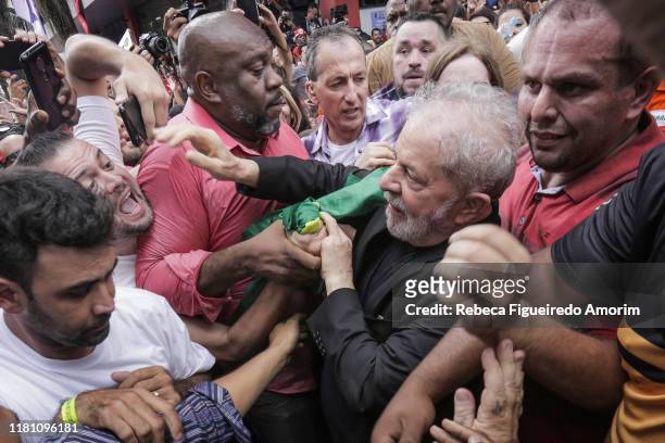 Luiz Inacio 'Lula' da Silva, former president of Brazil, is greeted by supporters as he arrives at a rally outside the Sindicato dos Metalurgicos do...