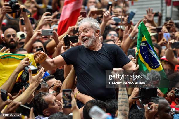 Luiz Inacio Lula da Silva, Brazil's former president, greets supporters outside of the Sindicato dos Metalurgicos do ABC on November 9, 2019 in Sao...