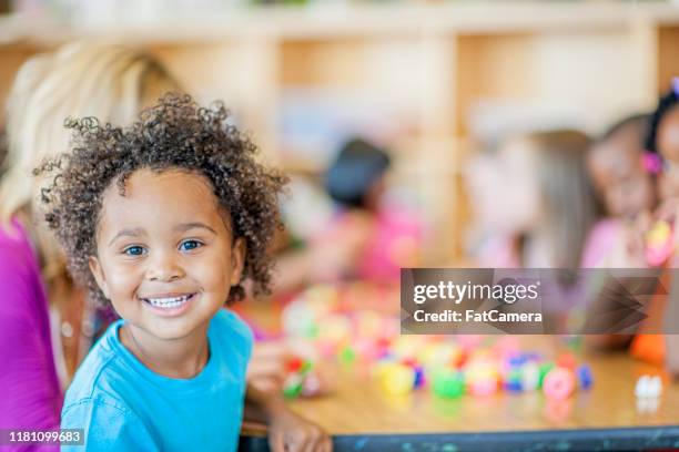groups of kids in preschool stock photo - 2 boys 1 girl stock pictures, royalty-free photos & images