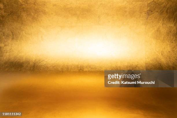 gold foil wallpaper texture background - gold coloured stock pictures, royalty-free photos & images